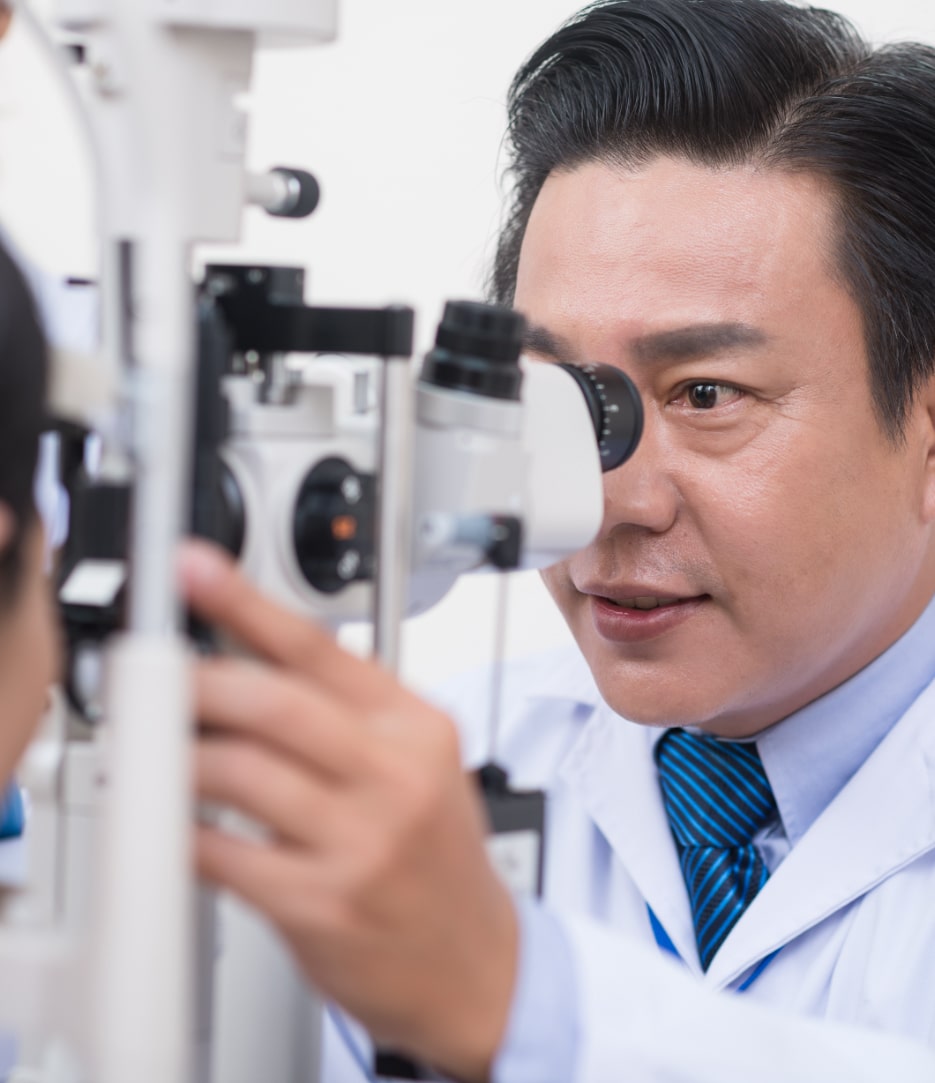 Doctor examining patients eyes